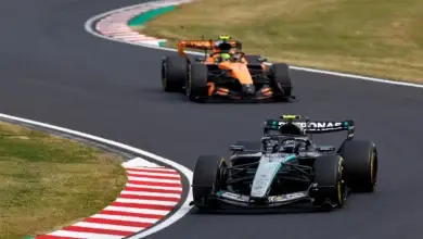 Lando Norris follows Kimi Antonelli on track during the Austrian Grand Prix weekend, highlighting McLaren’s rear‑wing delay frustrations.