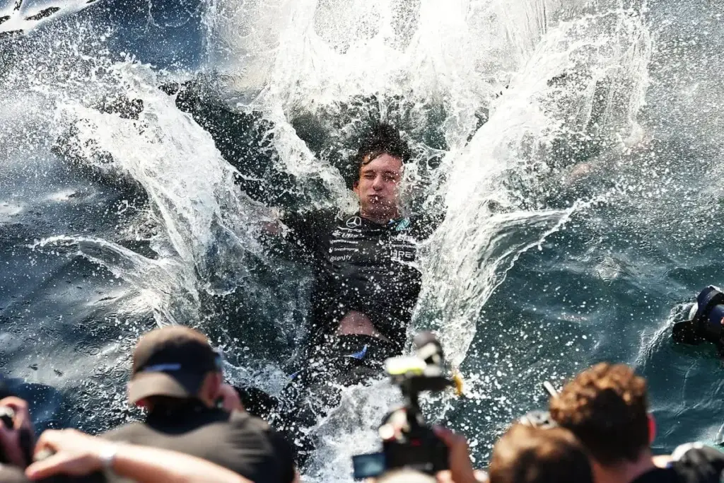 Race winner Kimi Antonelli celebrates by jumping into the sea with his team during the F1 Grand Prix of Monaco © Mercedes-AMG Petronas F1 Team Media