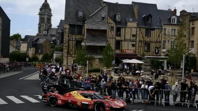 Ferrari 499P Hypercar undergoing scrutineering during the 2026 Le Mans Pesage in the city centre.