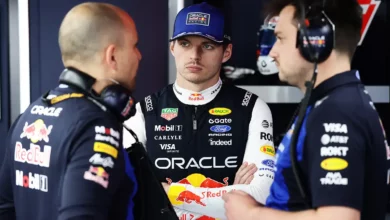 Max Verstappen talks with engineers inside the Red Bull Racing garage during Monaco qualifying.