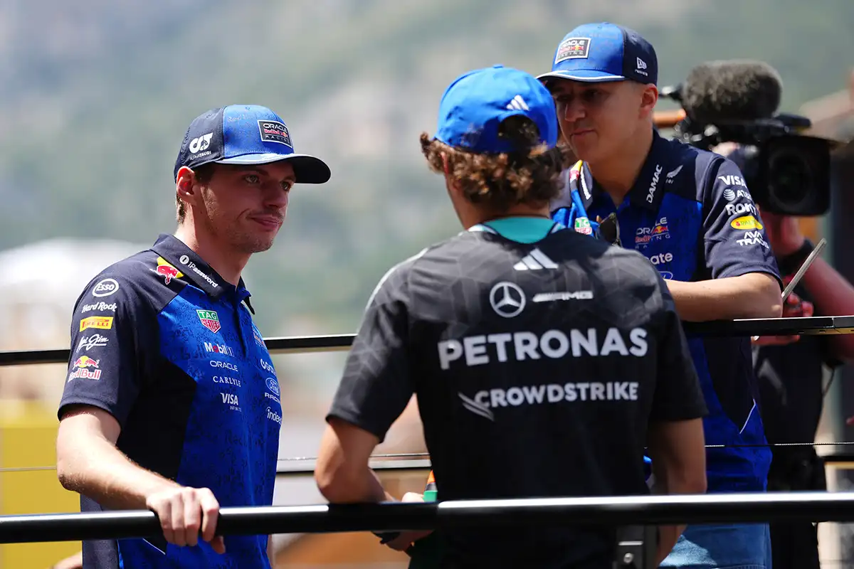 Max Verstappen in a focused conversation with Mercedes talent Kimi Antonelli, amid growing speculation about Verstappen’s next career move. ©RedBullContentPool