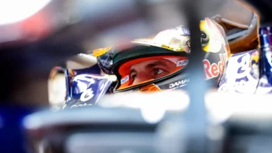 Max Verstappen showing his Verstappen Orange Lion Helmet design ahead of the Austrian Grand Prix.