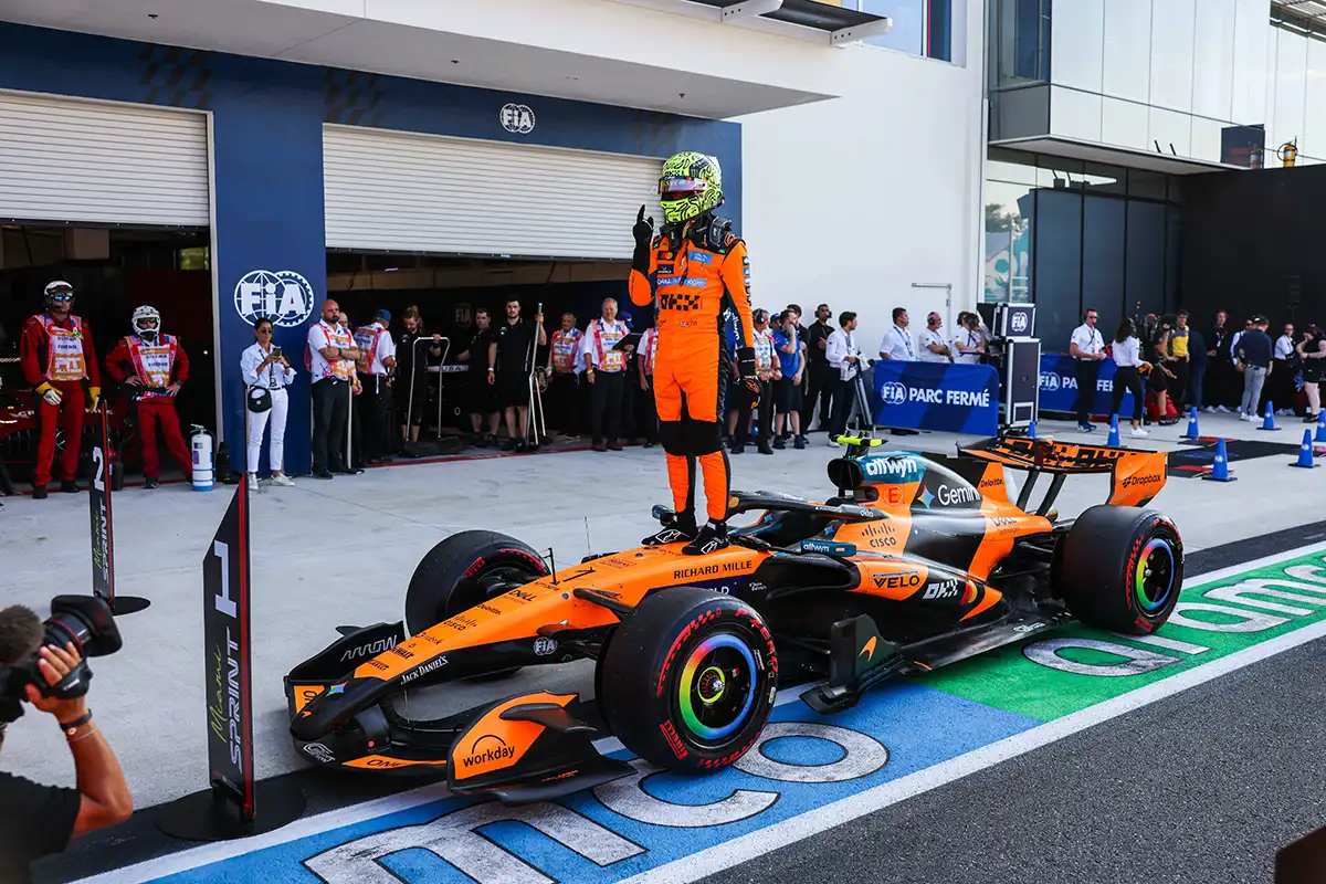 Lando Norris celebrates on top of his McLaren after taking Sprint Qualifying pole at the 2026 Miami Grand Prix. Norris title defence.