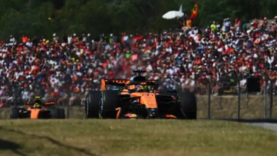 Oscar Piastri leads Lando Norris in their McLaren MCL40s during the Hungarian Grand Prix, both cars running in the papaya livery.
