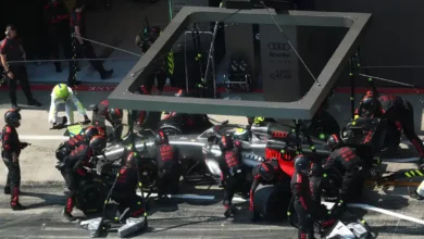 Audi F1 car during a high‑pressure pit stop with full crew support, illustrating the intensity behind the Audi ADUO rethink Mercedes upgrade fears. © Audi Media Centre