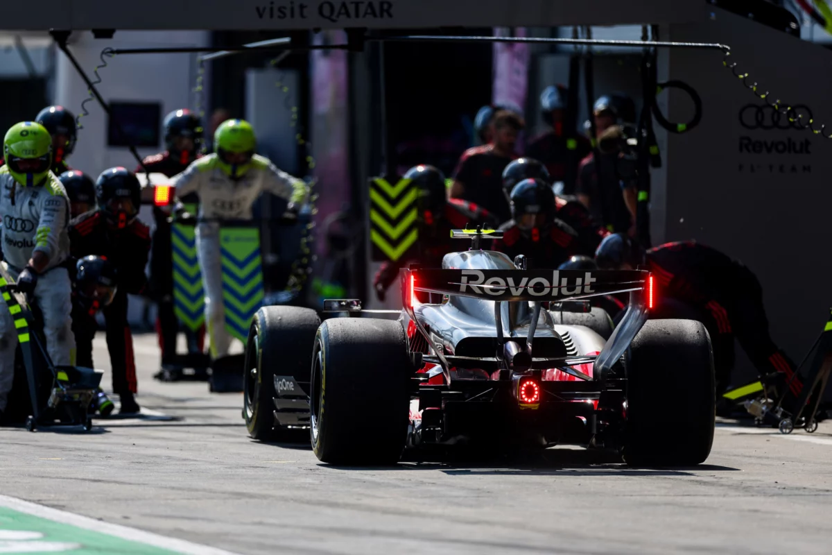 Audi F1 car stopping for a pit stop during the Belgian Grand Prix 2026, highlighting critical energy management strategy at Spa.