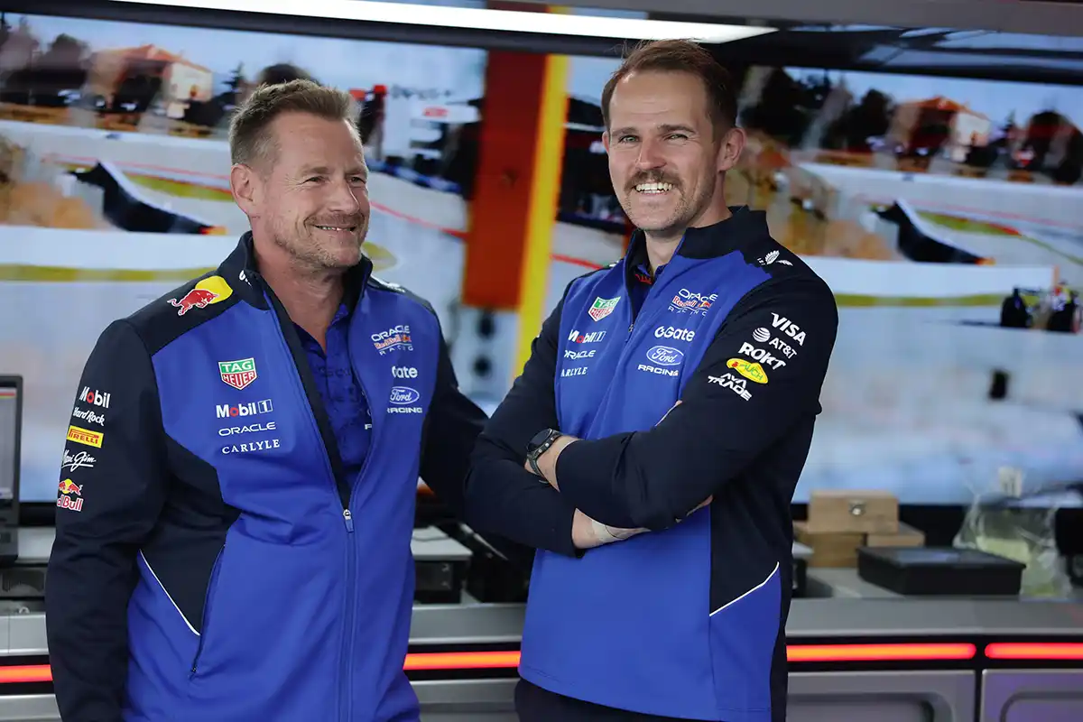 Richard Wolverson and Tom Hart of Oracle Red Bull Racing observe garage operations during the 2026 Japanese Grand Prix previews at Suzuka. © Red Bull Content Pool / Getty Images