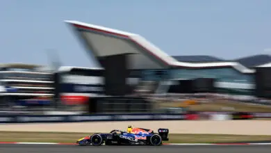 Red Bull RB22 at Silverstone during the British Grand Prix, Max Verstappen pushing through high‑speed corners — © RedBullContentPool