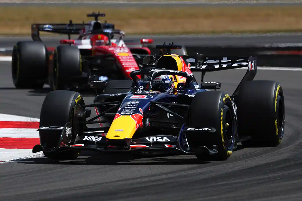 Max Verstappen in the Red Bull RB22 ahead of Charles Leclerc in the Ferrari