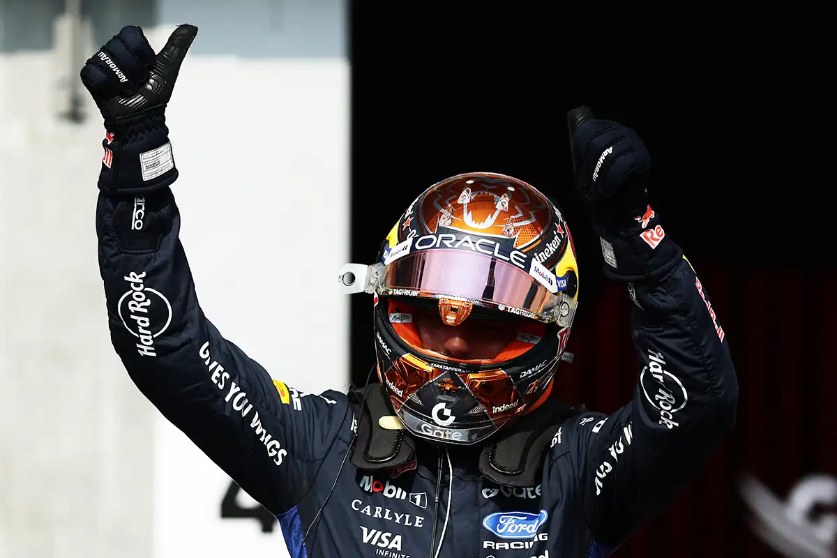 Max Verstappen waves to the crowd at Spa‑Francorchamps after securing P2 in Belgian Grand Prix qualifying, celebrating with fans during the 2026 season.