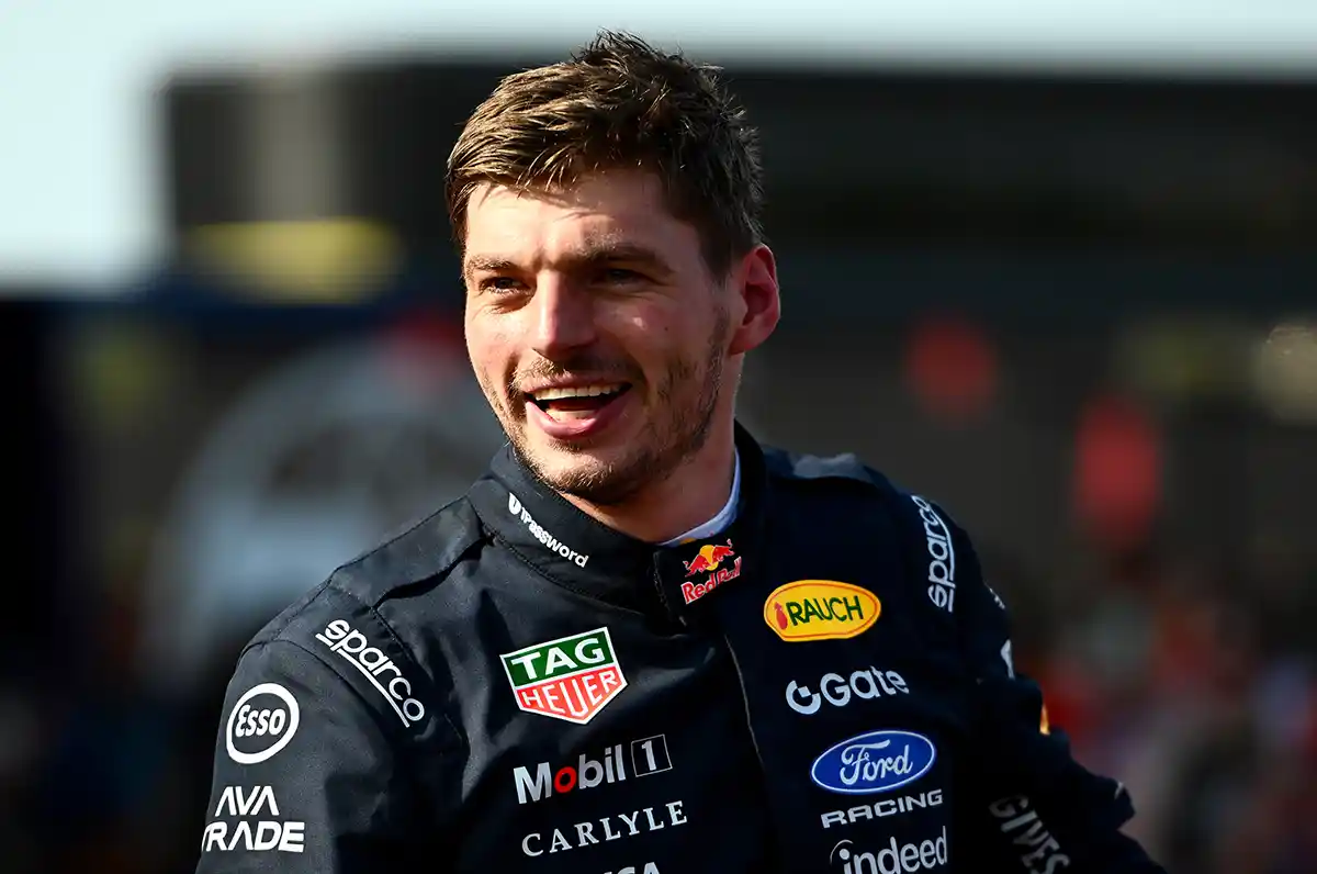 Max Verstappen smiling in his Red Bull race suit after the 2026 Hungarian Grand Prix