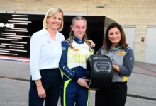 Susie Wolff stands with Jessica Edgar and Marta Gasparin during the F1 Academy Pirelli Pole Position Award ceremony at Circuit of the Americas, photographed by Mark Sutton.