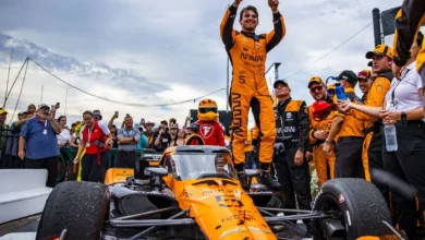 Pato O'Ward celebrates on his Arrow McLaren Chevrolet in victory lane at the Milwaukee Mile