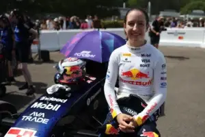 Alisha Palmowski beside her F1 Academy car at the Goodwood Festival of Speed.