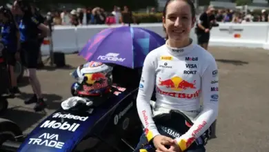 Alisha Palmowski beside her F1 Academy car at the Goodwood Festival of Speed.