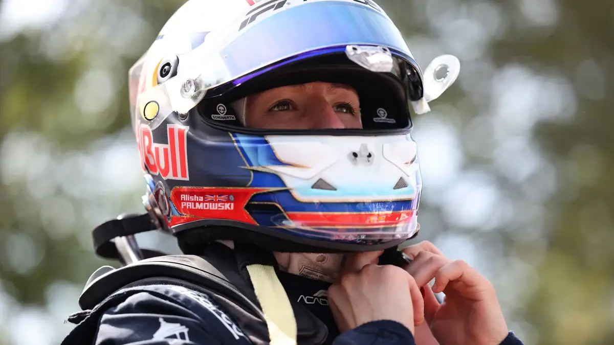 Alisha Palmowski fastening her helmet.