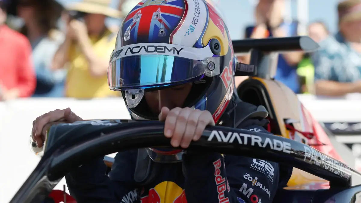 Alisha Palmowski climbing into the Tatuus F1 Academy car at Goodwood.