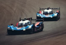 The number 35 Alpine A424 leads the number 36 Alpine A424 through a corner in the FIA WEC