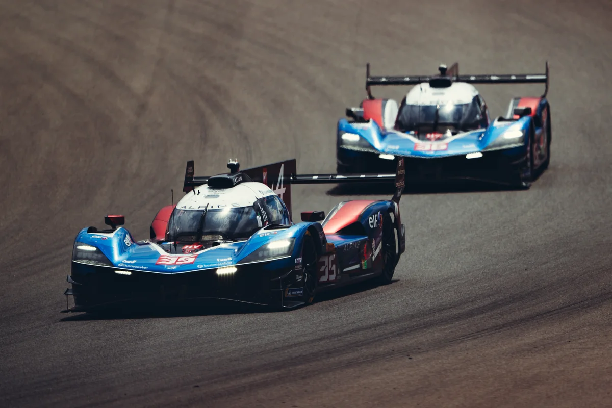 The number 35 Alpine A424 leads the number 36 Alpine A424 through a corner in the FIA WEC