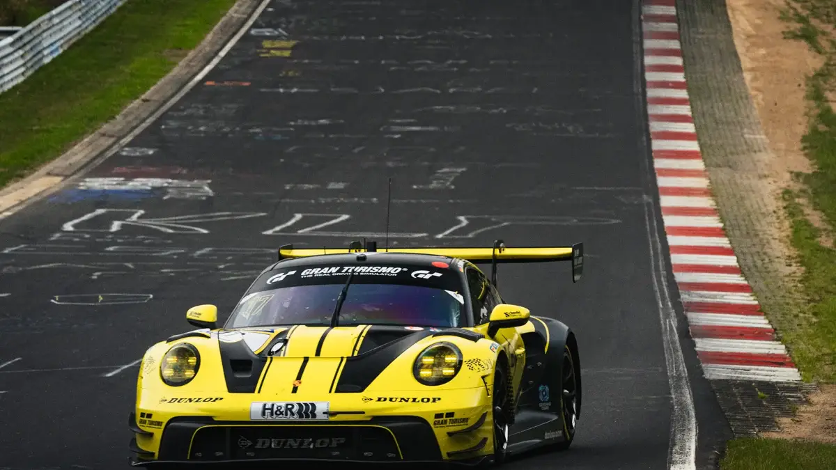 A Porsche on track during NLS9 at the Nurburgring in wet conditions.