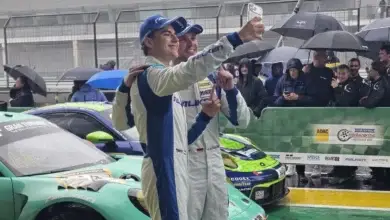 Morris Schuring and Tim Heinemann take a selfie beside the winning number 44 Falken Porsche after NLS9