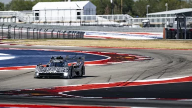 The camouflaged Ferrari 499P Evo test mule on track at the Circuit of the Americas