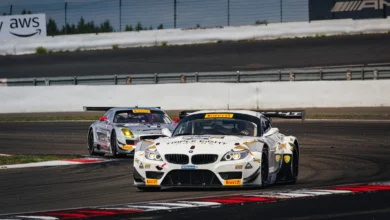 The #888 BMW Z4 GT3 ahead of the Mercedes-Benz SLS AMG GT3 of Heiko Neumann at the Nürburgring