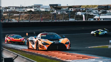 The number 58 Garage 59 McLaren 720S GT3 Evo over the kerbs at Zandvoort
