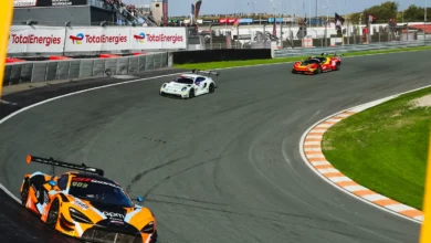 The number 58 Garage 59 McLaren 720S GT3 Evo through the banked Hugenholtzbocht at Circuit Zandvoort during GT World Challenge Europe Race 2 in 2026