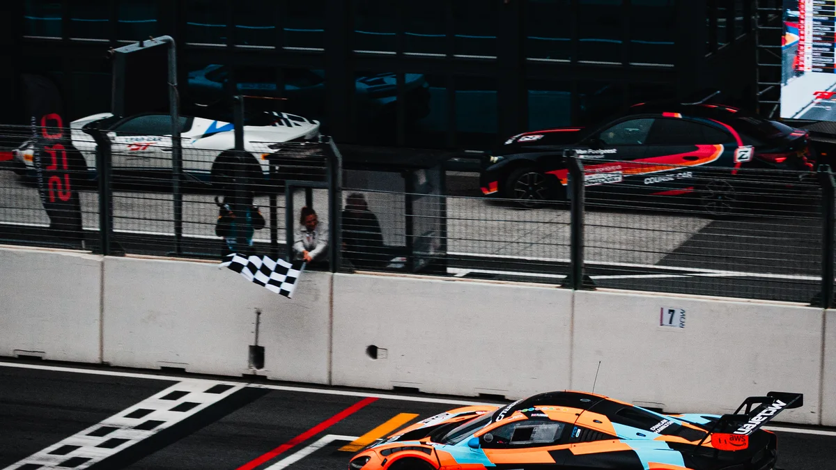 The number 58 Garage 59 McLaren takes the chequered flag to win Race 1 at Zandvoort on Saturday. Photo: Tessa van Duin / RNT-Motorsports