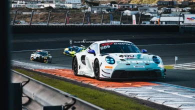 The number 80 Lionspeed GP Porsche 911 GT3 R over the kerbs during Race 2 at Zandvoort