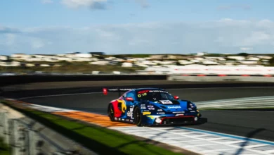 A Porsche 911 GT3 R through the banking during Friday practice at Zandvoort