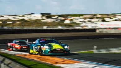 Two Porsche 911 GT3 R cars nose to tail during Friday practice at Zandvoort