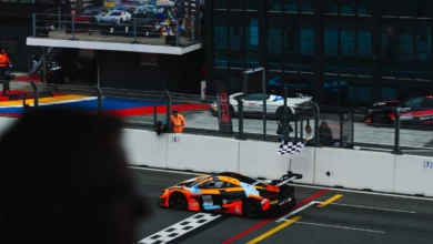 The number 58 Garage 59 McLaren crosses the line to win Race 1 at Zandvoort