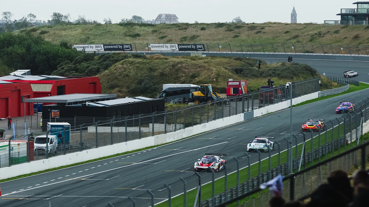Four GT3 cars running nose to tail on the main straight at Zandvoort in the fight for fourth place