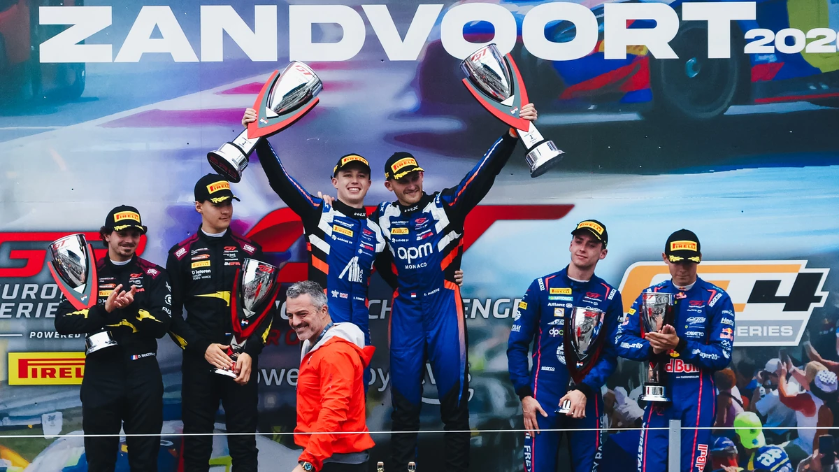 The three crews on the Race 1 podium at Zandvoort, with Prette and Fleming of Garage 59 holding their trophies in the middle