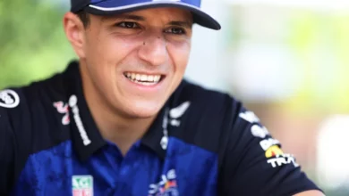 Isack Hadjar smiling in the paddock; he misses the 2026 Italian Grand Prix with a fractured wrist