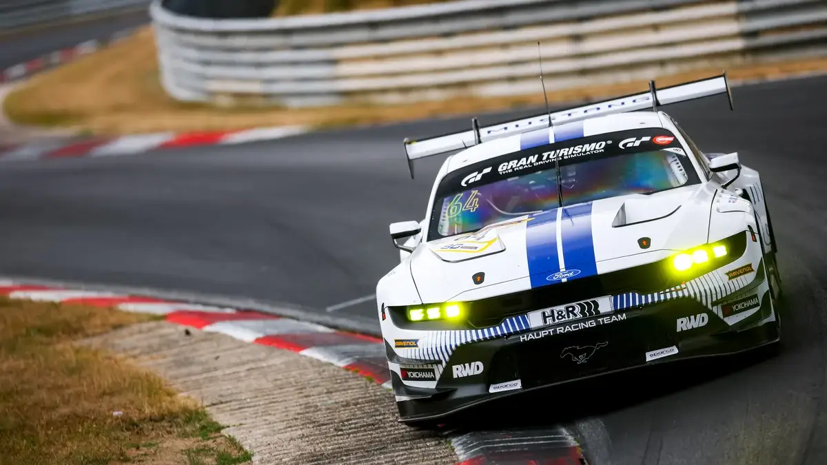 The white Haupt Racing Team Ford Mustang GT3 number 64 of Vincent Kolb and Frank Stippler on the Nordschleife