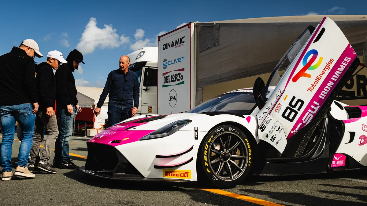 The #85 Iron Dames Maserati GT2 with its doors open in the Zandvoort paddock
