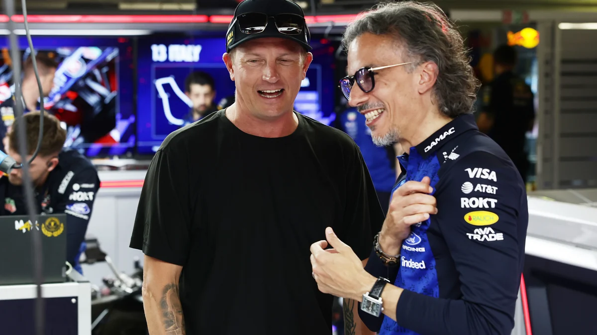 Kimi Raikkonen talking with Red Bull team principal Laurent Mekies in the garage at Monza
