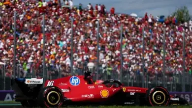 Charles Leclerc on track at Monza in front of a packed tifosi grandstand