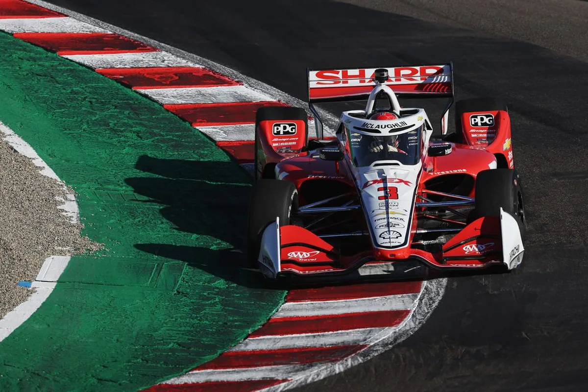 The number 3 DEX Team Penske Chevrolet of Scott McLaughlin over the kerbs at Laguna Seca