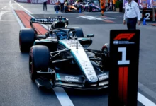 George Russell's Mercedes W17 parked behind the number 1 board in parc fermé after winning the 2026 Azerbaijan Grand Prix