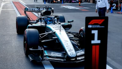 George Russell's Mercedes W17 parked behind the number 1 board in parc fermé after winning the 2026 Azerbaijan Grand Prix