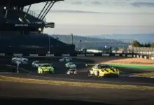 A group of GT3 cars including the Manthey Porsche 911 GT3 R running through the Grand Prix circuit at the Nurburgring during the NLS8 weekend