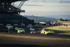 A group of GT3 cars including the Manthey Porsche 911 GT3 R running through the Grand Prix circuit at the Nurburgring during the NLS8 weekend