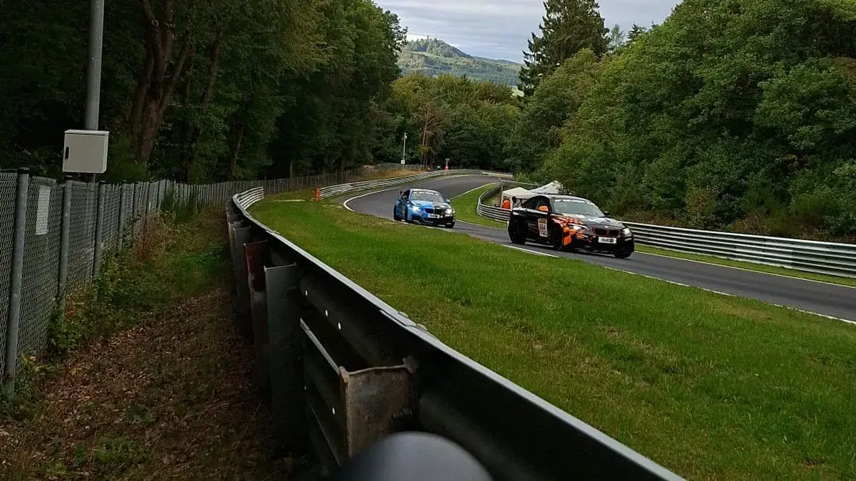 Cars on a damp Nordschleife at the Nurburgring