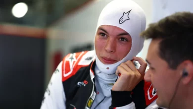 Oliver Bearman in a balaclava in the Haas garage at Monza