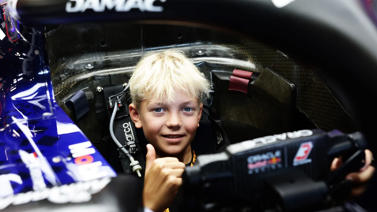 Robin Raikkonen sitting in a Red Bull Formula 1 cockpit at Monza