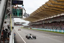 Lewis Hamilton's Mercedes takes the chequered flag on the Sepang main straight at the 2017 Malaysian Grand Prix